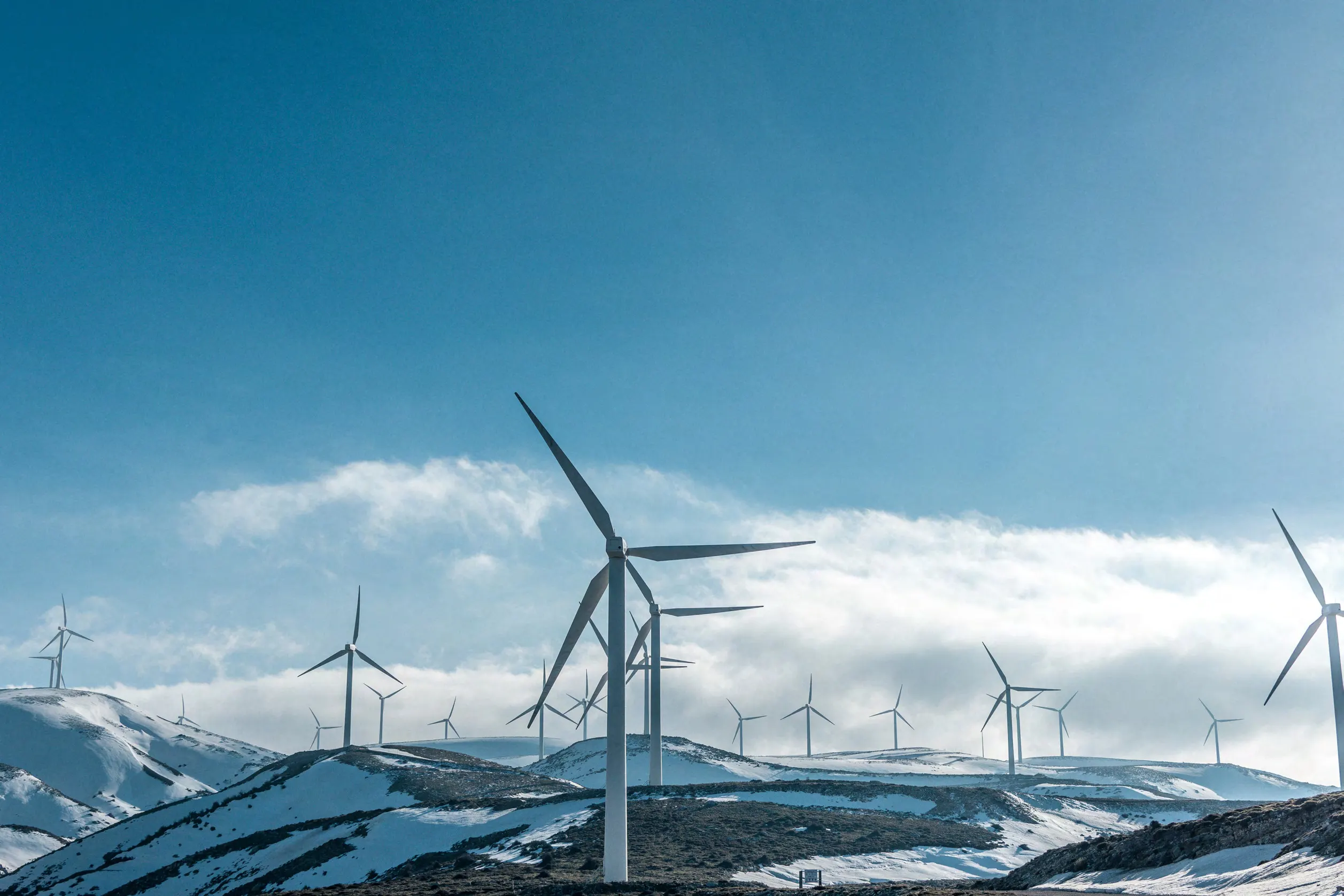 Wind turbines against a blue sky